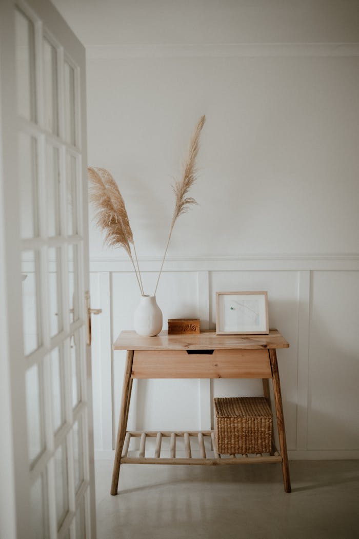 Brown Wooden Table With White Ceramic Vase on Top